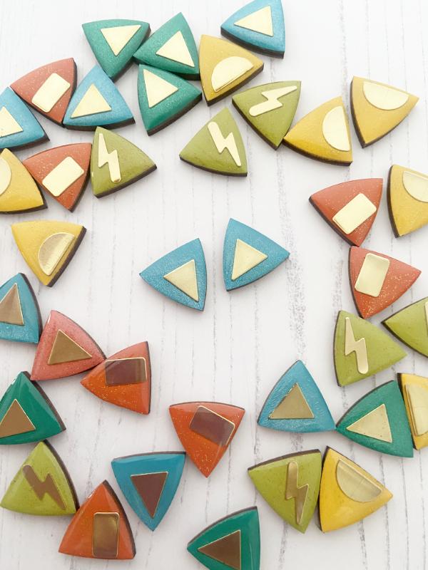 hand painted triangle earrings in metallic blue and green with brass triangles added.